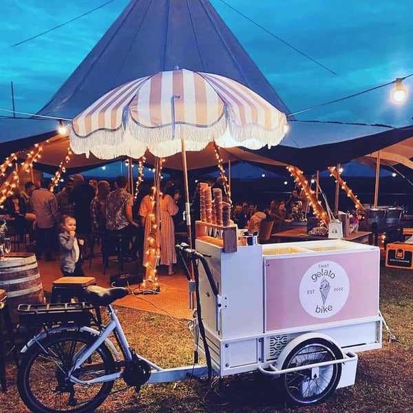 Electric ice cream and drinks bike, eco-friendly and fully equipped for mobile vending, with a built-in cooler for ice cream and drinks. Ideal for festivals, events, or street vending. Available at Promo Wheels