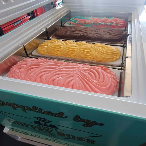 Delicious ice cream tubs in a 198L chest freezer cart, supplied by PromoWheels, featuring vibrant flavours and a sleek design. Perfect for events, markets, and businesses.
